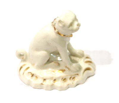 Lot 271 - A Rockingham porcelain figure of a pug, circa 1830, naturalistically modelled seated with a...