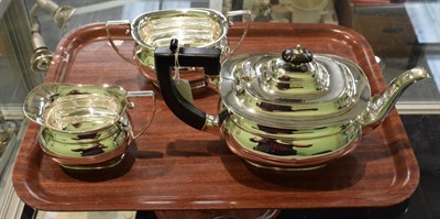 Lot 288 - A three-piece George VI silver tea-service, by Cooper Brothers and Sons Ltd., Sheffield, 1937, each