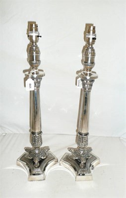 Lot 441 - A Pair of Lamp Bases, with stylised leaf capitals and  fluted columns, leaf sheathed bases on...