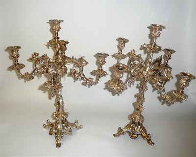 Lot 443 - A Pair of Plated Five-Light Candelabra, late 19th century, with fruiting vine cast sconces,...