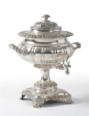 Lot 446 - A George IV Sheffield Plate Tea Urn, circa 1820, the square pedestal base rising to a lobed...