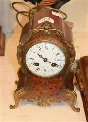 Lot 373 - ^ A French red tortoiseshell and brass inlaid mantel clock