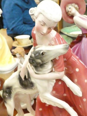 Lot 374 - ^ Katzhutte Art Deco figure group, modelled as a lady in pink dress with a hound; together with...
