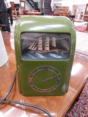Lot 1098 - A 1930s green bakelite cased Vitascope clock with ship automata