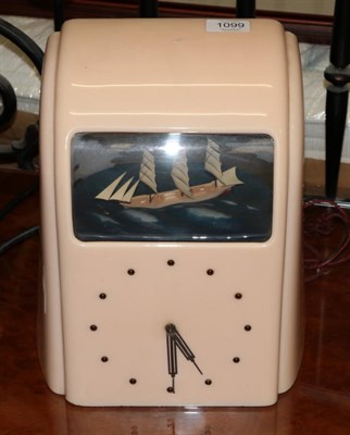 Lot 1099 - A 1930s pink bakelite cased Vitascope clock with ship automata