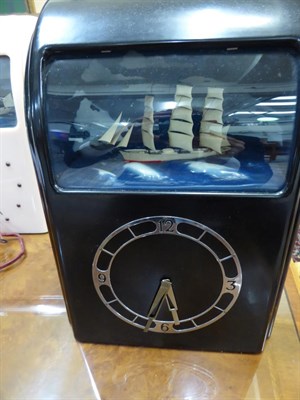 Lot 1101 - A 1930s black bakelite cased Vitascope clock with ship automata