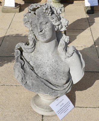 Lot 1110 - A large weathered composition bust of a classical female on a circular socle, with a sectional...