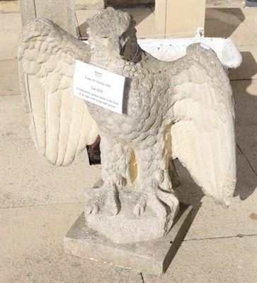 Lot 1113 - A composition garden statue in the form of an eagle with wings half spread