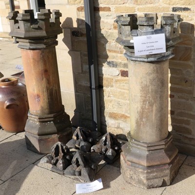 Lot 1116 - A pair of castellated chimney pots
