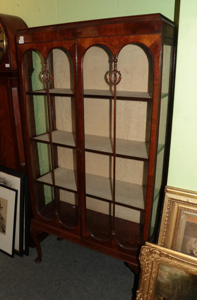 Lot 1131 - ^ A 1920's walnut display cabinet on shell carved legs, 91cm wide