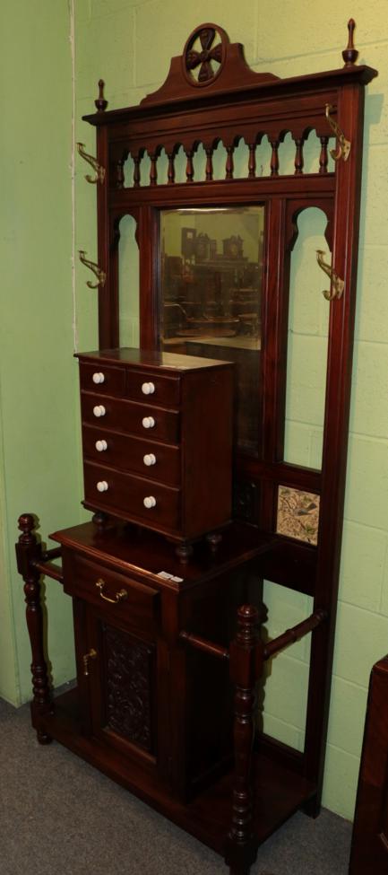 Lot 1136 - A reproduction hardwood hall stand, in the Victorian Style, with bevel glass mirror and four...