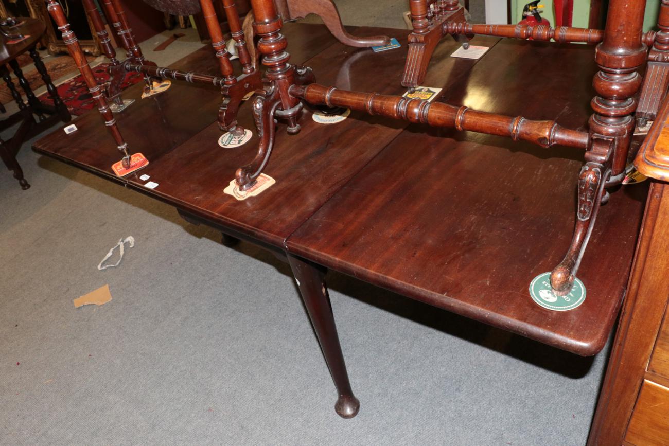 Lot 1152 - George II mahogany gateleg dining table, raised on tapering legs with pad feet