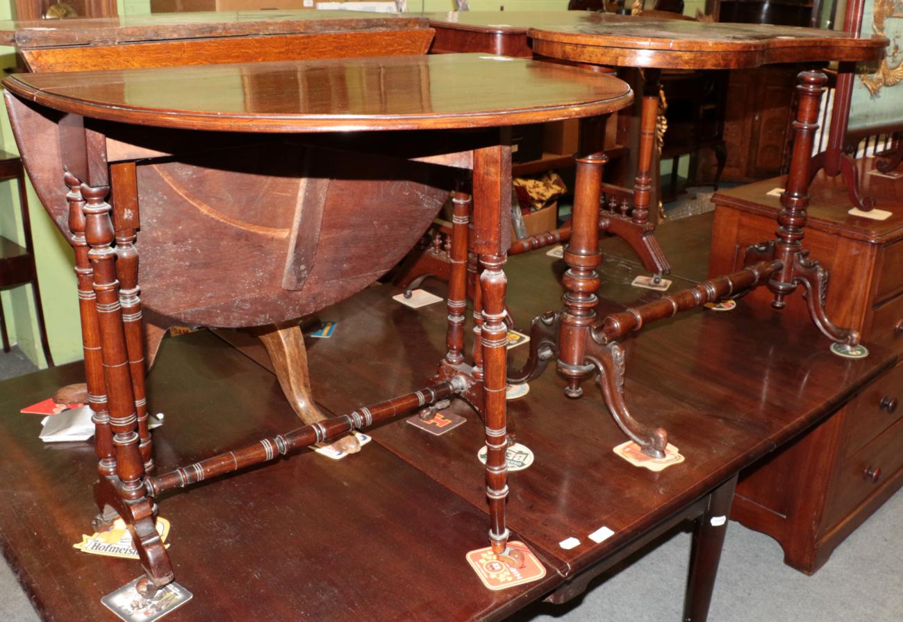Lot 1153 - ^ A Victorian walnut kidney shaped occasional table with leather top, 91cm wide; and a...