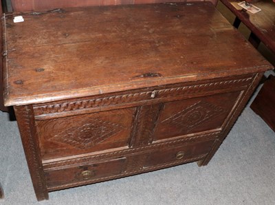 Lot 1154 - ^ An early 18th century carved oak chest with lozenge carved panels, 98cm wide