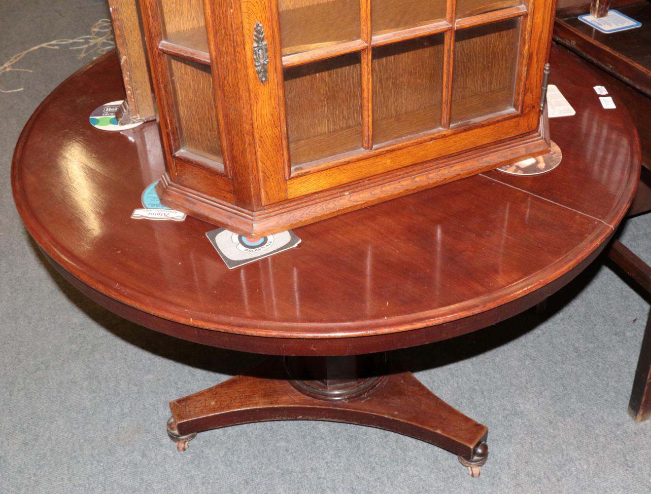 Lot 1157 - A Victorian mahogany circular breakfast table, circa 1840, on an octagonal tapering stem and...