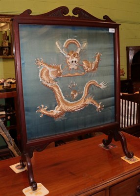 Lot 1164 - An Edwardian fire screen with Chinese padded 'Imperial' dragon insert on green silk