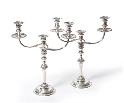 Lot 467 - A Pair of Elizabeth II Three-Light Candelabra, Garrards, London 1957, with waisted sconces on...