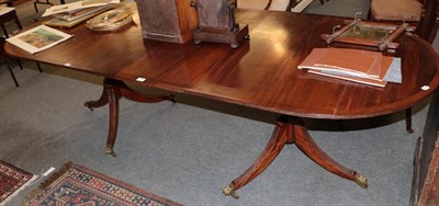 Lot 1194 - A 20th century mahogany twin pedestal D end dining table, with one additional leaf