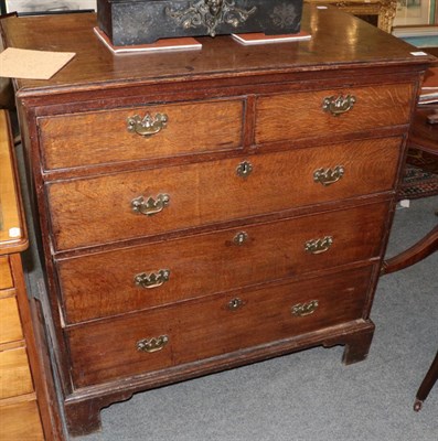 Lot 1196 - George II oak five drawer straight fronted chest of drawers