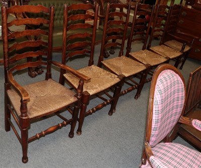 Lot 1203 - Set of six ash and rush seated ladder back chairs, including two carvers
