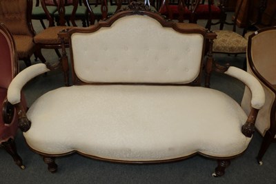 Lot 1209 - A Victorian two seater sofa, upholstered in cream fabric, 163cm wide