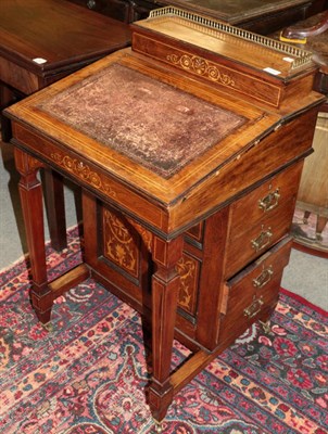 Lot 1222 - ^ A late Victorian inlaid rosewood Davenport, 56cm wide