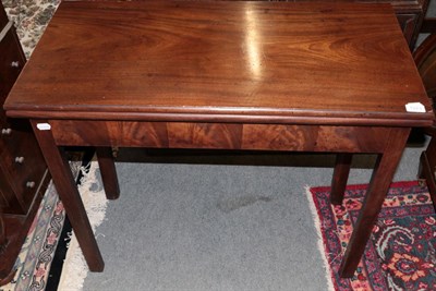 Lot 1223 - ^ A George III mahogany fold over tea table on square chamfered legs, 91cm