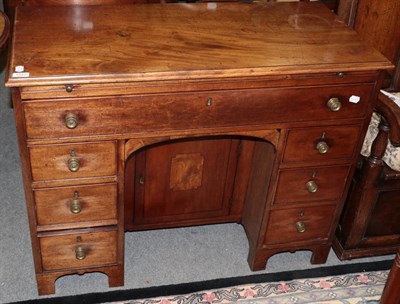 Lot 1227 - George III mahogany knee hole desk