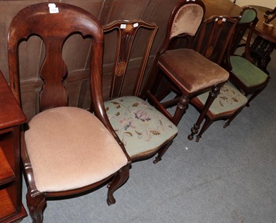 Lot 1235 - ^ A pair of inlaid rosewood nursing chairs with green floral needlework seats; a late Victorian...