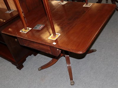 Lot 1237 - ^ A Regency mahogany drop leaf sofa table on reeded legs, 91cm wide