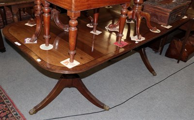 Lot 1243 - ^ A Regency style mahogany twin pedestal dining table
