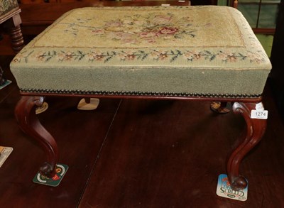 Lot 1274 - ^ A Victorian mahogany stool with floral needlework cover, 66cm wide
