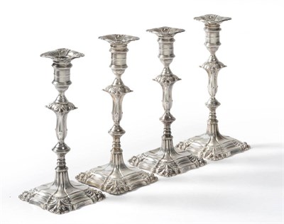 Lot 477 - A Set of Four Edward VII Candlesticks, George Edward & Sons, Sheffield 1908, the shaped square...