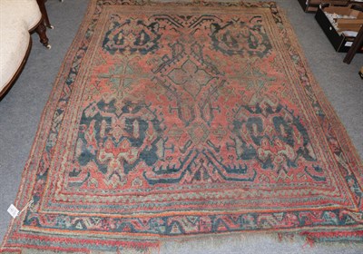 Lot 1294 - Ushak carpet, the soft brick red field with central floral head medallion enclosed by multiple...