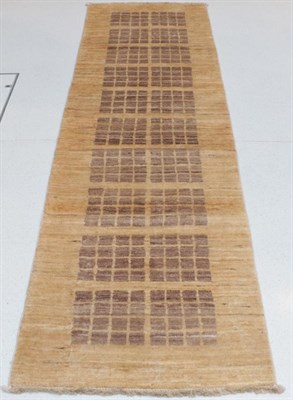 Lot 1301 - Modernist Hand-Knotted Narrow Runner, North Afghanistan, the shaded camel field with two columns of
