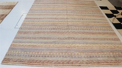 Lot 1302 - Modernist Hand-Knotted Rug, probably Indian, the field comprised of four columns of ivory and...