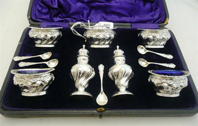 Lot 485 - A Victorian Seven Piece Condiment Set, Walker & Hall Ltd, Birmingham 1900, of part spirally...