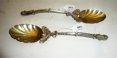 Lot 491 - A Pair of Victorian Serving Spoons, maker's mark AJR, Sheffield 1880, with fluted oval silver...