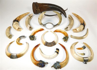 Lot 122 - Sporting: A Quantity of Various Tusks, circa early 20th century, a single Cow horn with leather...