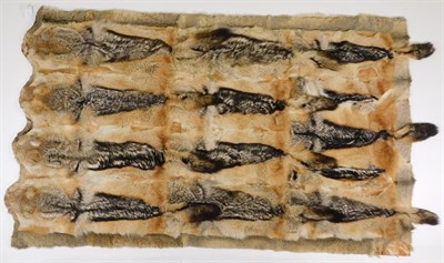 Lot 409 - Taxidermy: Black-backed Jackal Carriage/Car Rug (Canis mesomelas), a large patchwork carriage...