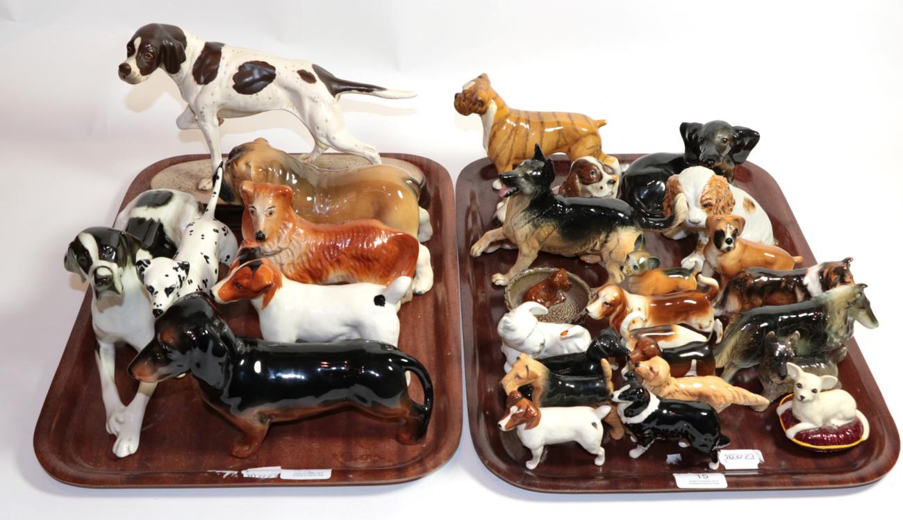 Lot 15 - Beswick dogs including Pointer on plinth, Dalmation, Dachshund, Terrier and foreign dog models...