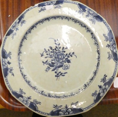 Lot 26 - An English Delft plate, circa 1750, painted in blue with a chinoiserie figure in a garden...