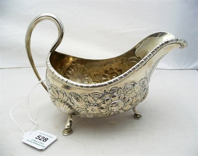 Lot 528 - A George III Irish Sauceboat, Robert Breading, Dublin 1787, of low bellied form on three cast...