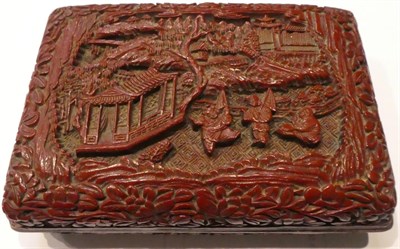 Lot 75 - A Chinese cinnabar lacquer box and cover, bears Qianlong reign mark, of cushioned rectangular...