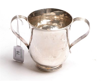 Lot 78 - A George III silver two-handled cup, by James Young, London, 1783, baluster and on spreading...