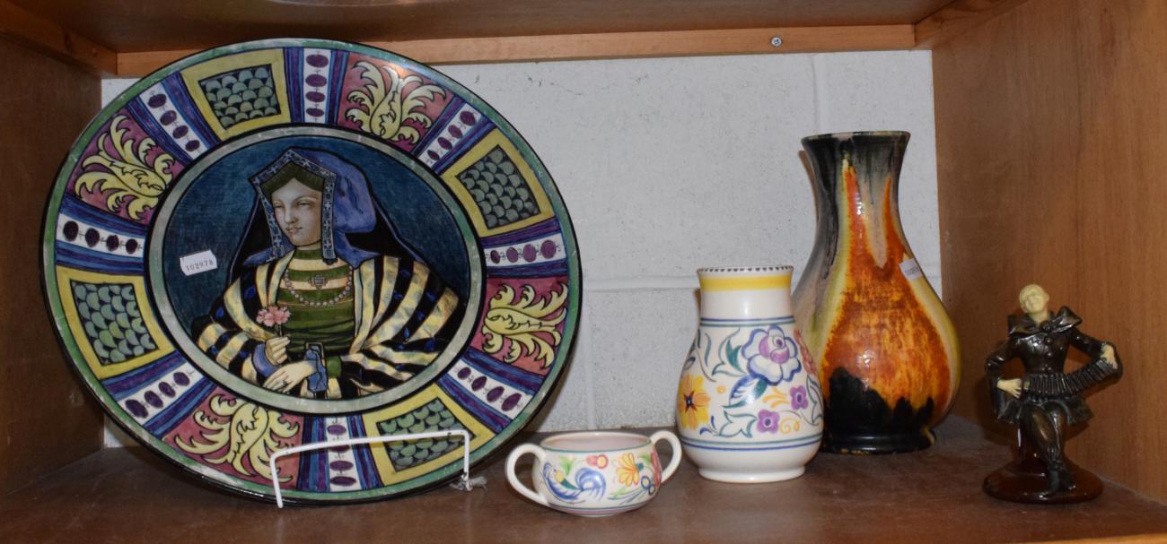 Lot 101 - Two pieces of Poole pottery, a decorative vase and charger and a model after Chiparus