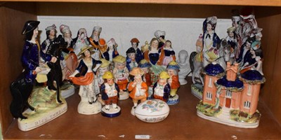 Lot 103 - A collection of Staffordshire figures, Toby pepperettes, cottages etc