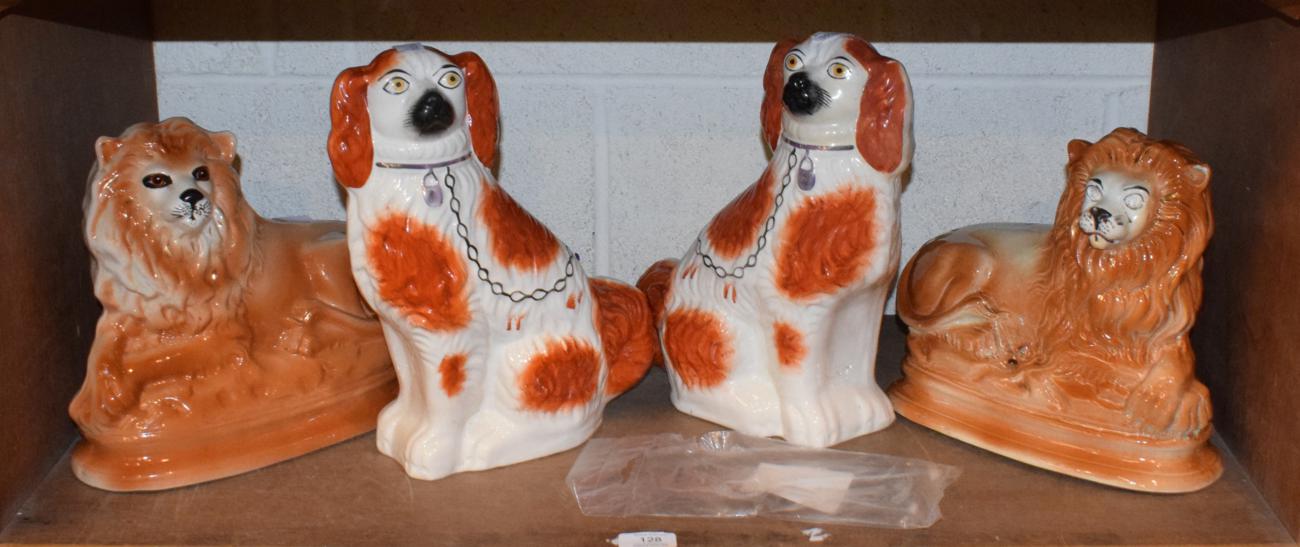 Lot 128 - Two Staffordshire dogs, and two Staffordshire lions (4)