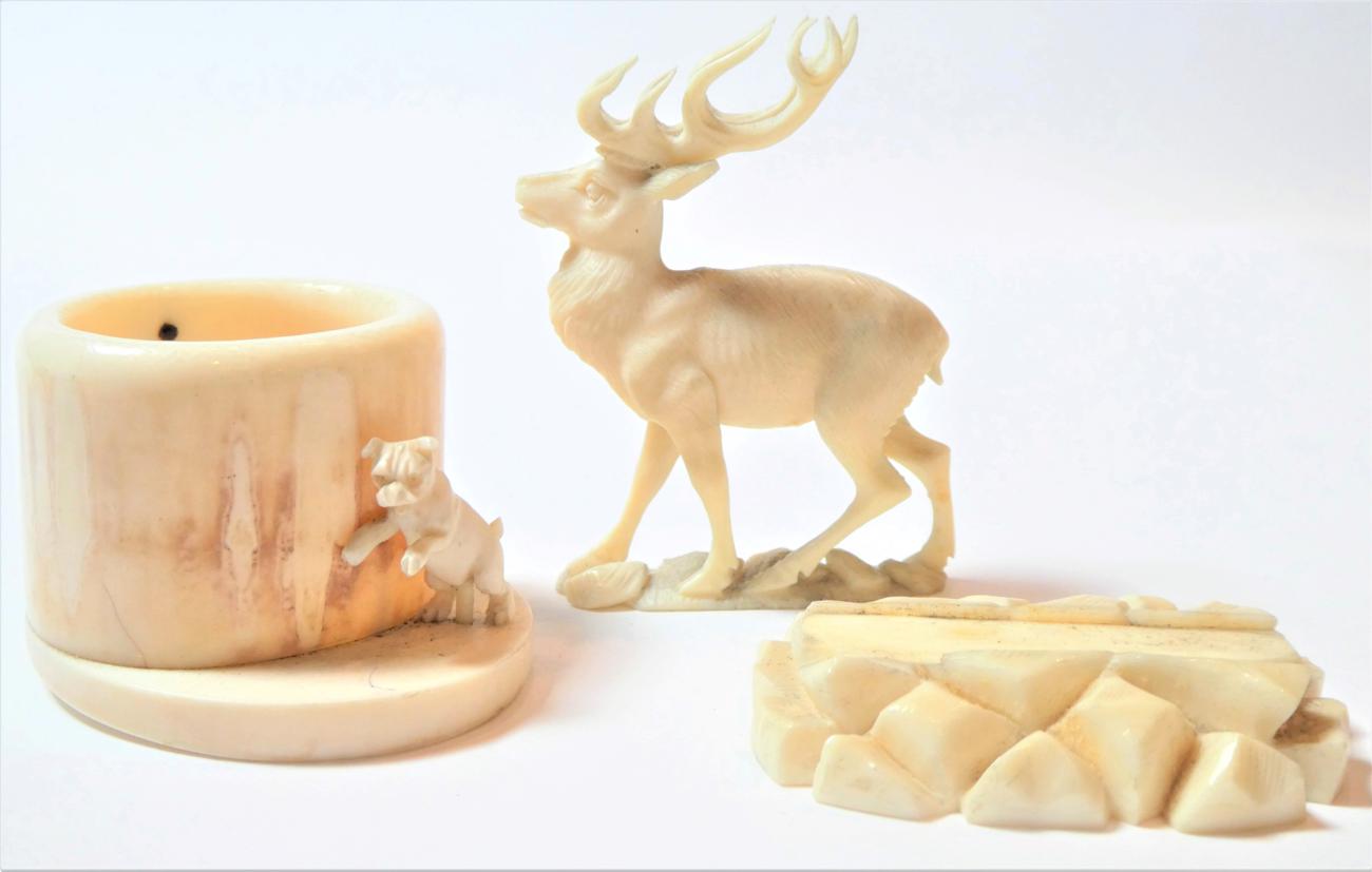 Lot 141 - An Austrian ivory model of a stag, circa 1900, naturalistically modelled on a mound base, 6cm long