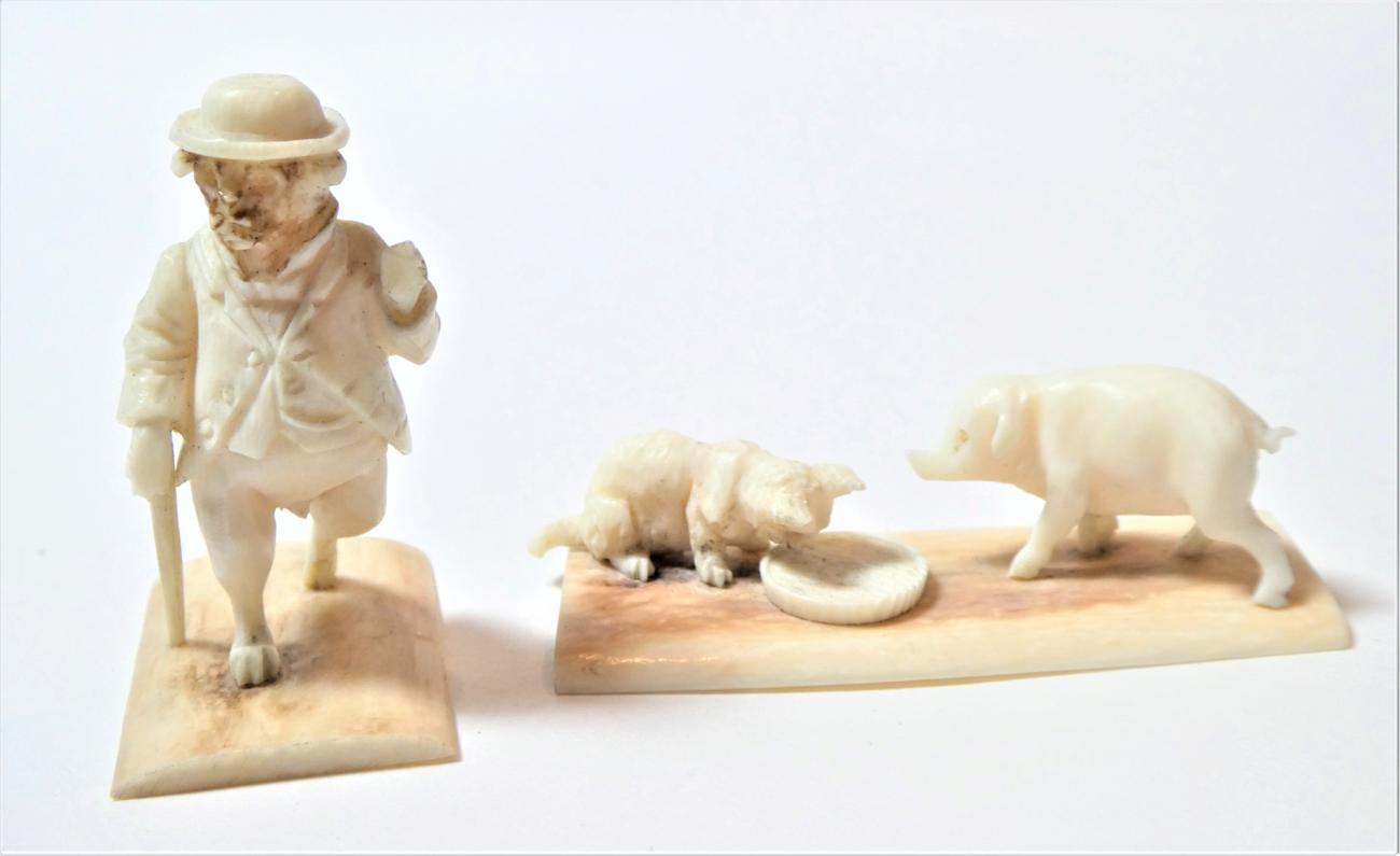 Lot 148 - An Austrian ivory anthropomorphic figure of a pup, circa 1900, walking on its hind legs wearing...